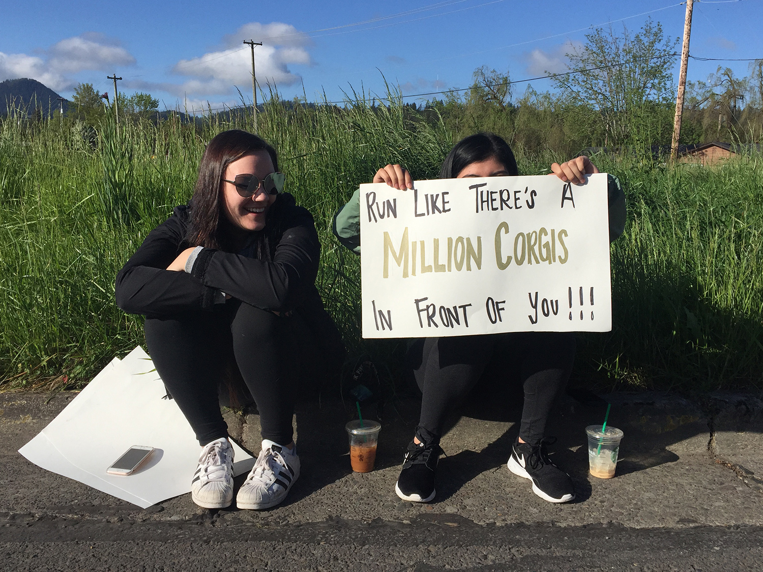 Spectator sign: “Run like there’s a million corgis in front of you!"