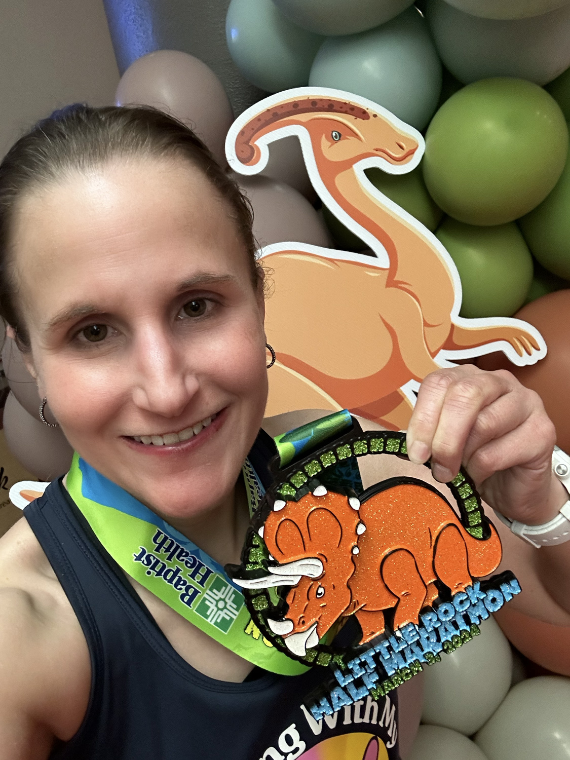 Me with the 2024 Little Rock Half Marathon medal