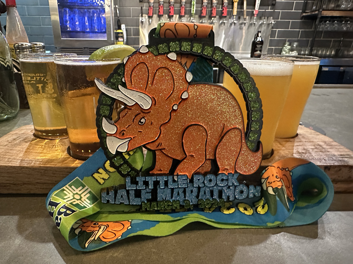2024 Little Rock Half Marathon medal and beer