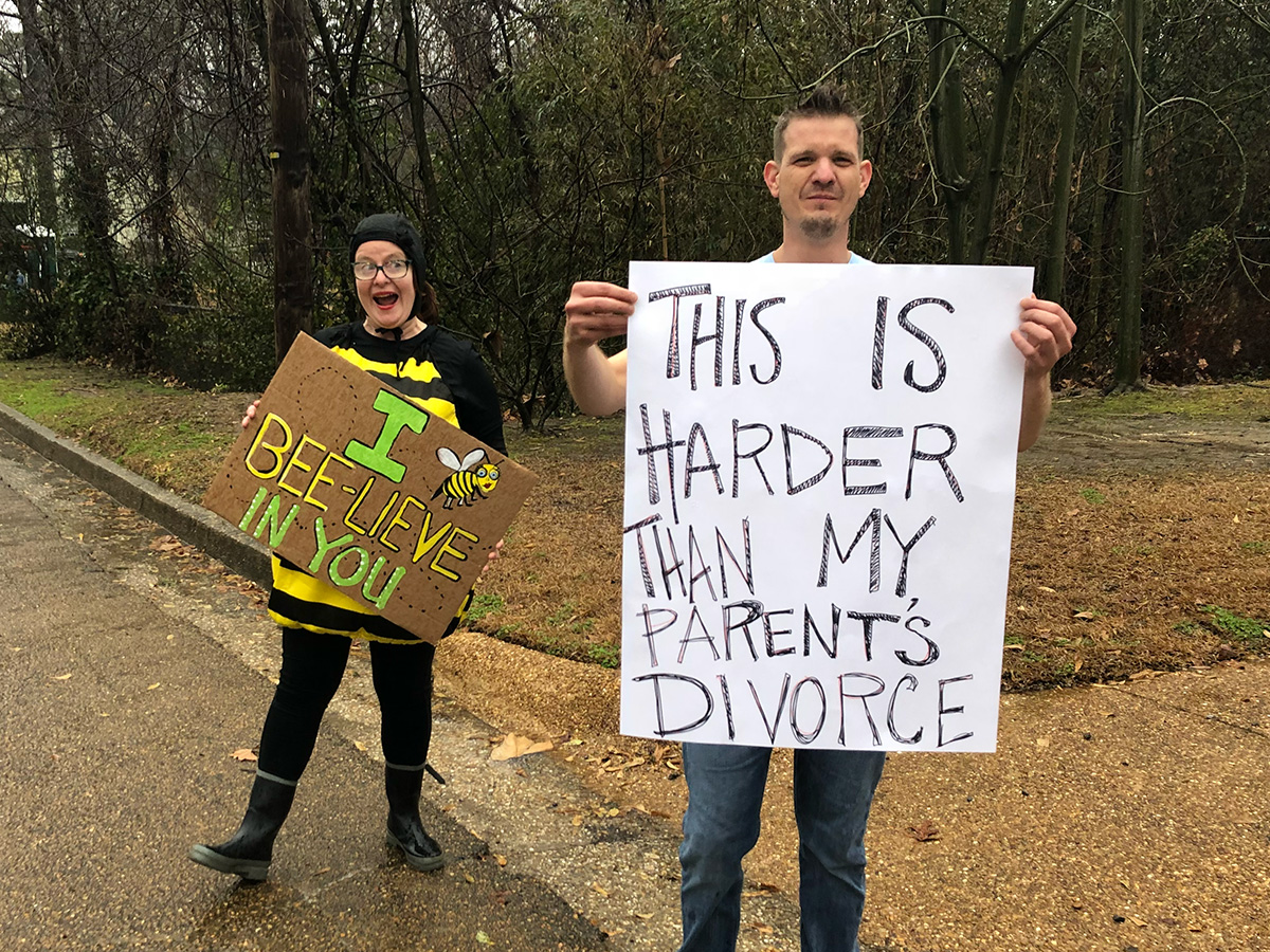 Spectator holding a "This is harder than my parents' divorce" sign