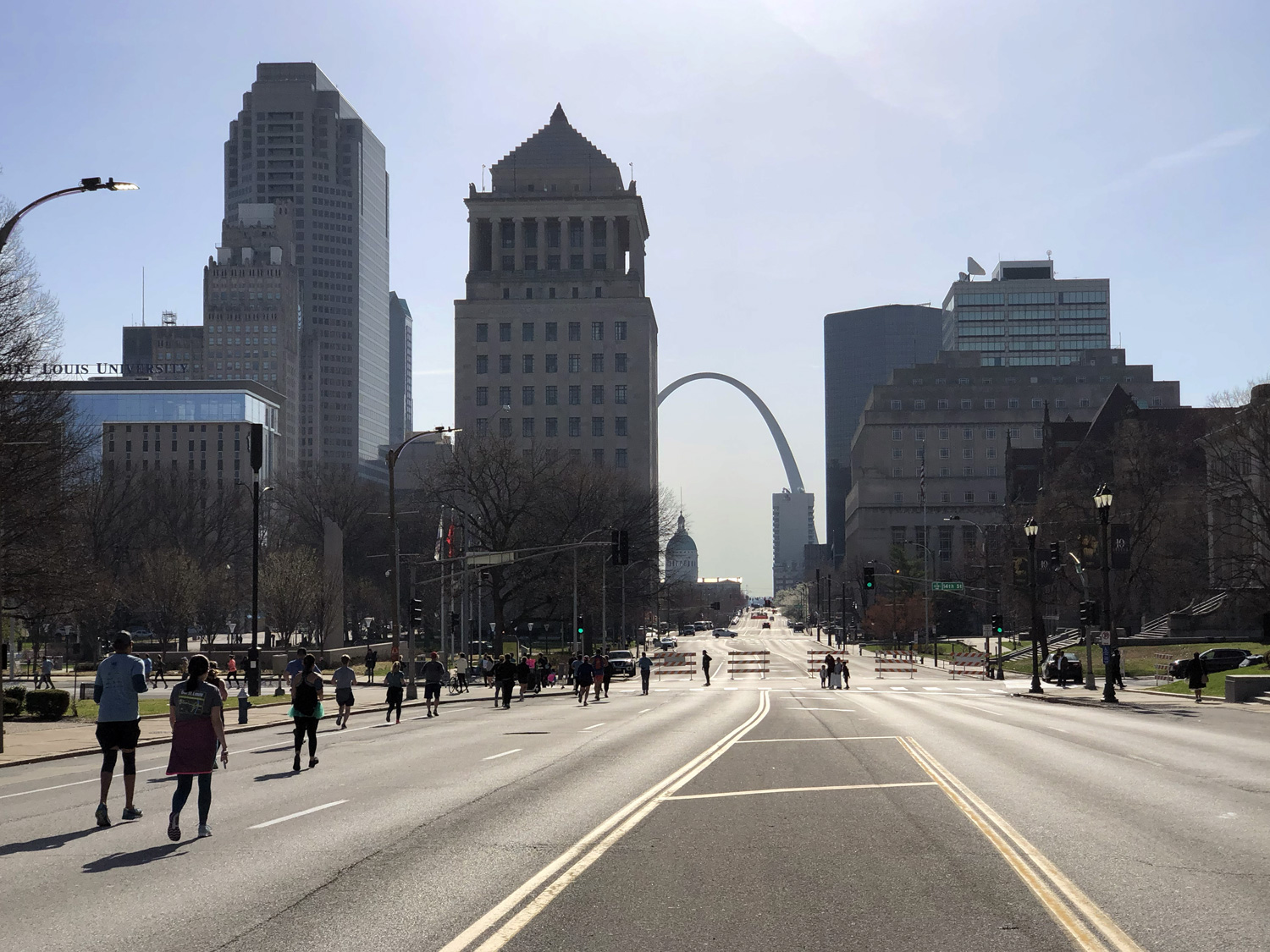 Running downtown with the Arch in distant view