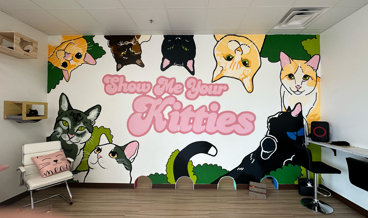 "Show me your kitties" wall mural at Cattitude Cafe