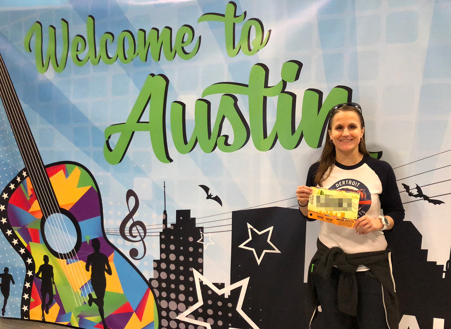 Photo op in front of the Welcome to Austin sign at the race expo